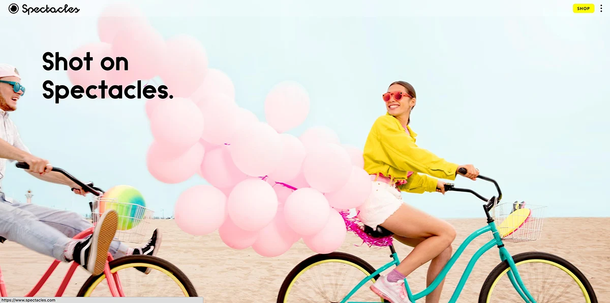 Shot on Spectacles campaign layout with cyclists and pink balloons.