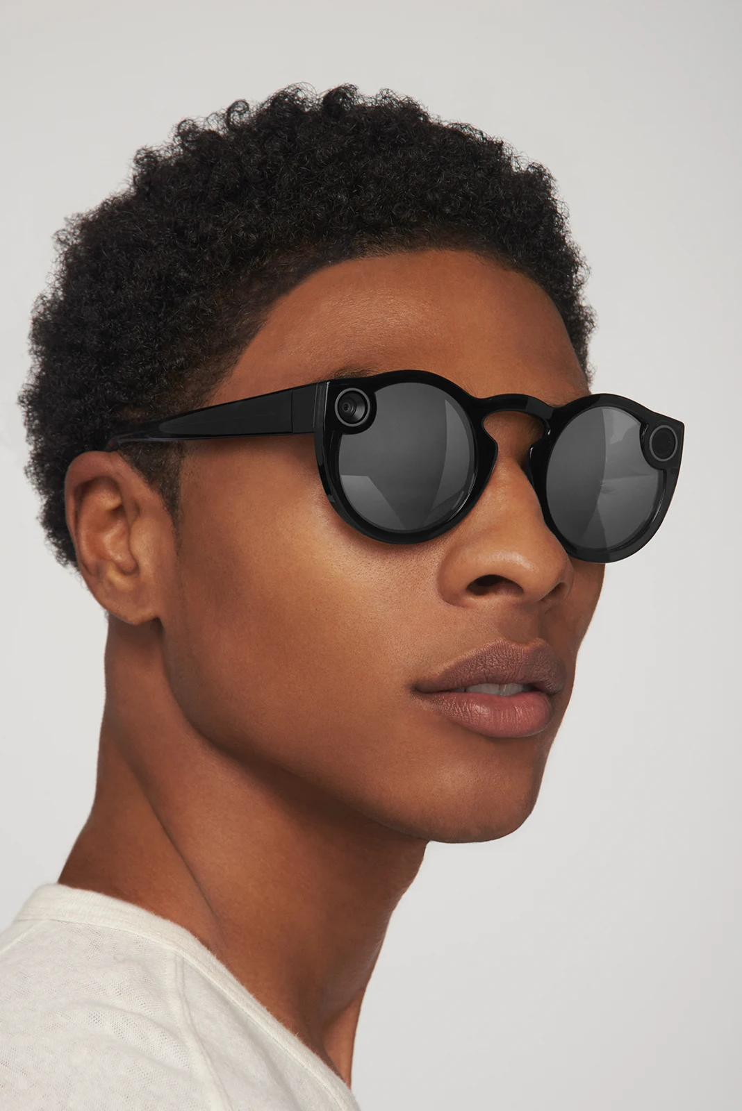 Close studio portrait of a round black Spectacles frame.