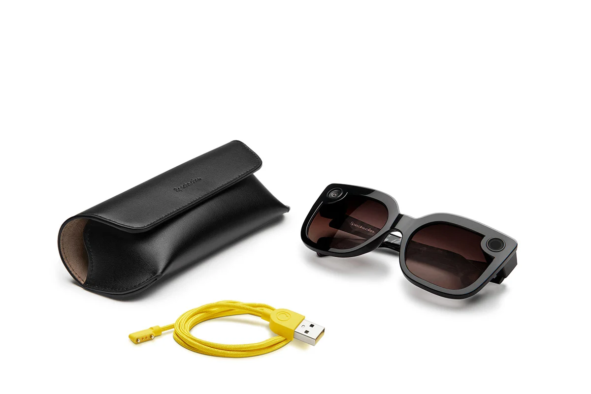 Rounded Spectacles frame with its case and charging cable.