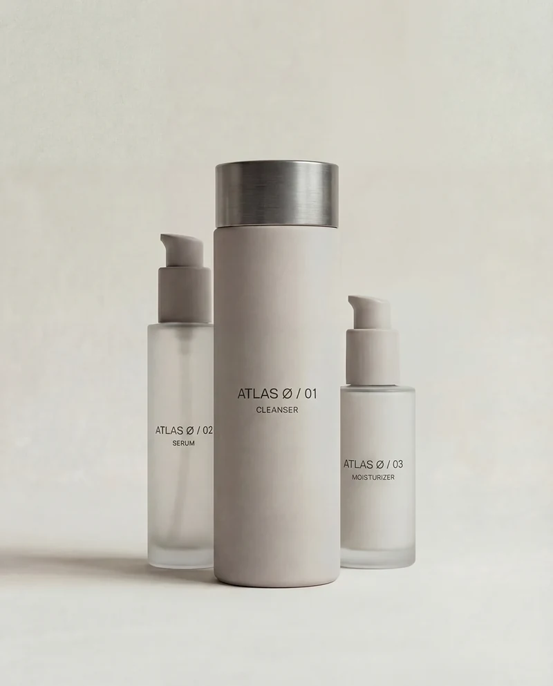 AI-generated ATLAS Ø skincare bottles arranged as a three-product family.