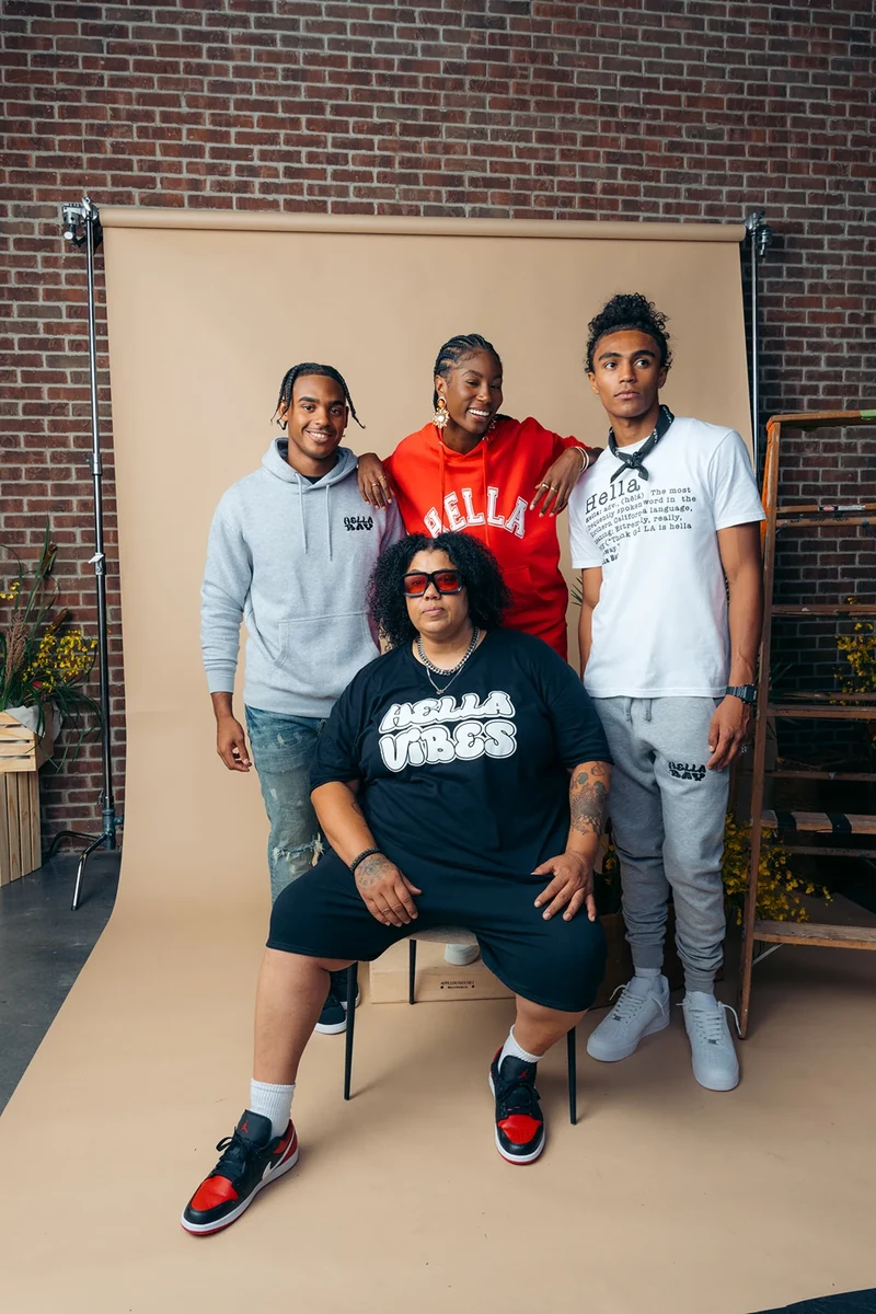 Alternate group portrait of four models in Hella Bay clothing.