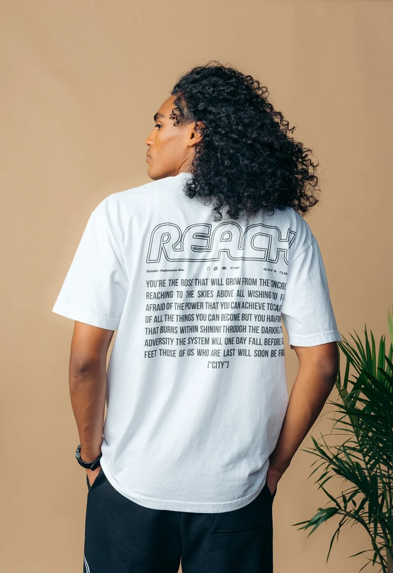 Rear view of a white tee with an outlined back print.