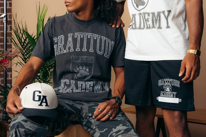 Two Gratitude Academy looks with a white basketball.