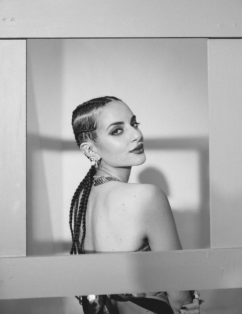 Monochrome portrait through a rectangular frame.