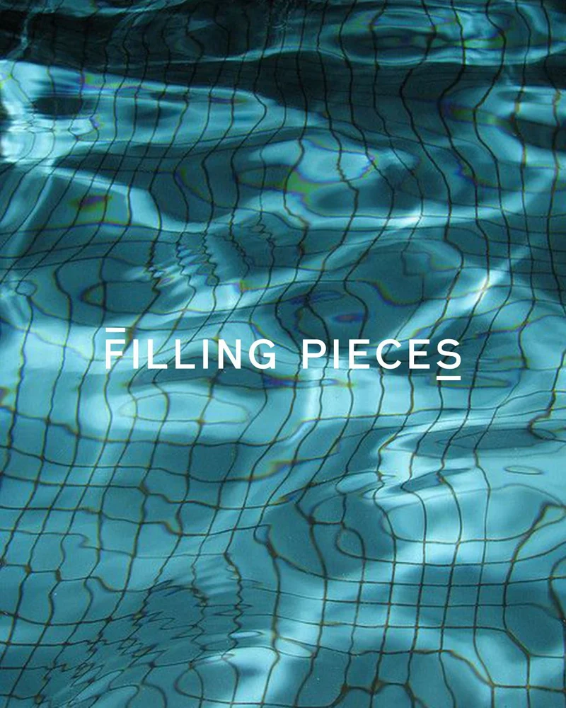 Filling Pieces wordmark over rippling blue pool water.