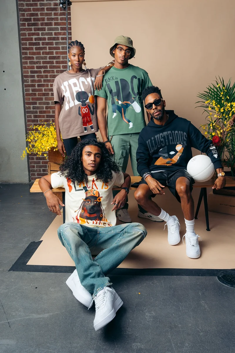 Four models in graphic tees and streetwear on the Threaded studio set.